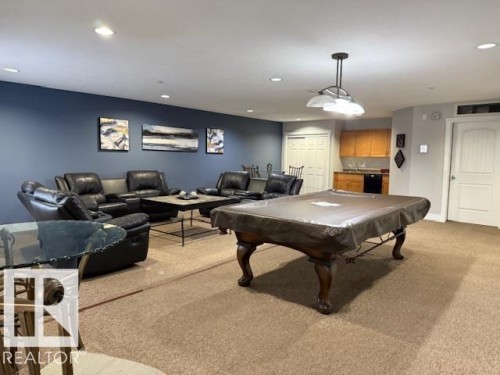 Rec room featuring light carpet, billiards table, and recessed lighting - 311 2098 Blackmud Creek Drive, Edmonton, AB 