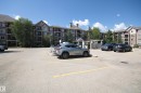 View of uncovered parking lot - 311 2098 Blackmud Creek Drive, Edmonton, AB 