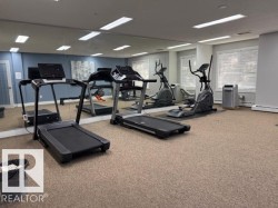 Workout area with carpet floors and baseboards - 