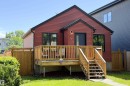 Red siding exterior with black trim windows - 10811 73 Avenue, Edmonton, AB 