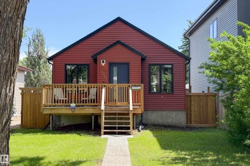 Red siding exterior with black trim windows - 10811 73 Avenue, Edmonton, AB 