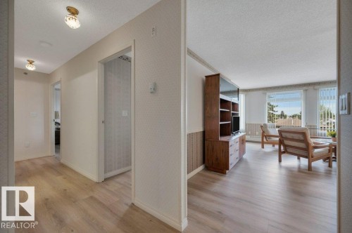 Open floor plan featuring wood-finish flooring throughout - 316 2011 137 Avenue, Edmonton, AB - Indoor