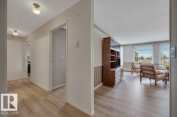 Open floor plan featuring wood-finish flooring throughout - 