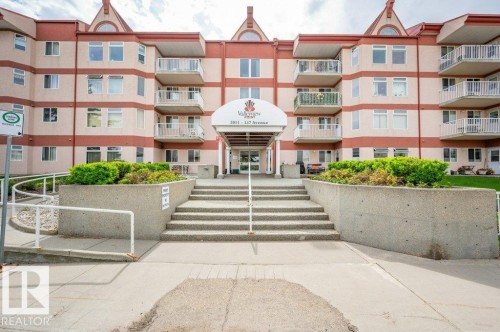 Multi-story residential building with a central entrance canopy and individual balconies - 316 2011 137 Avenue, Edmonton, AB - Outdoor With Balcony With Facade