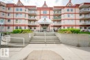 Multi-story residential building with a central entrance canopy and individual balconies - 316 2011 137 Avenue, Edmonton, AB  - Outdoor With Balcony With Facade 