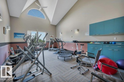 Vaulted ceiling with an arched window and ceiling fan - 316 2011 137 Avenue, Edmonton, AB - Indoor Photo Showing Gym Room