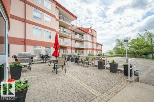 Expansive paver patio offering an outdoor living area - 316 2011 137 Avenue, Edmonton, AB - Outdoor With Balcony With Exterior