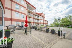 Expansive paver patio offering an outdoor living area - 