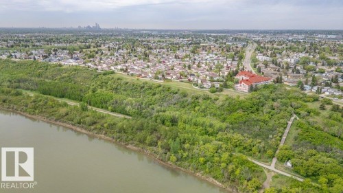 Aerial perspective showcasing a riverfront setting with established residential areas - 316 2011 137 Avenue, Edmonton, AB - Outdoor With Body Of Water With View