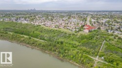 Aerial perspective showcasing a riverfront setting with established residential areas - 