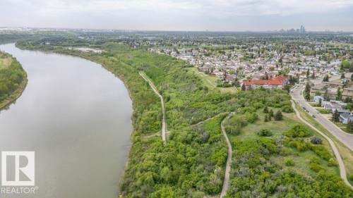 Expansive riverfront property featuring a winding waterway, lush green embankments, and extensive natural foliage - 316 2011 137 Avenue, Edmonton, AB - Outdoor With View