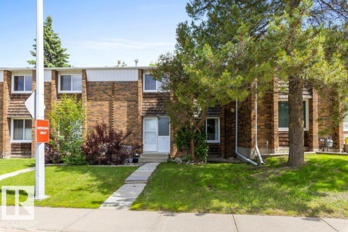Brick and wood-shingle exterior with white trim - 171 Ridgewood, St. Albert, AB 