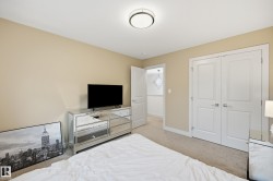 Neutral-toned walls complement the light-colored carpet flooring - 