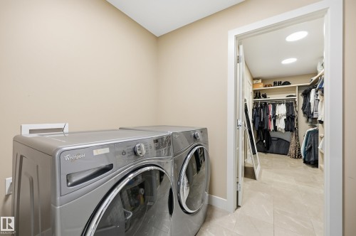 Dedicated laundry area with modern appliances and light-toned wall paint - 76 Jacobs Close, St. Albert, AB 