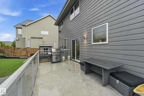 Concrete patio featuring a glass-paneled railing - 76 Jacobs Close, St. Albert, AB 