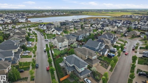 Aerial perspective of a developed residential area with a prominent body of water - 76 Jacobs Close, St. Albert, AB 