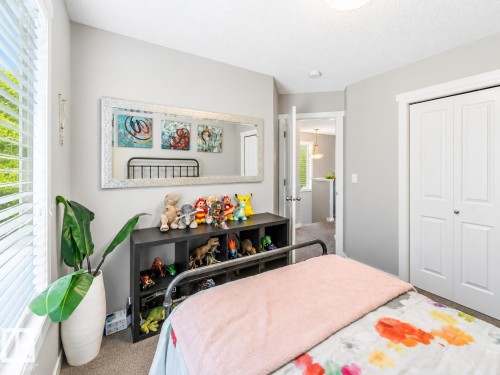 Light gray walls complement carpet flooring - 1908 25 Street Nw, Edmonton, AB 