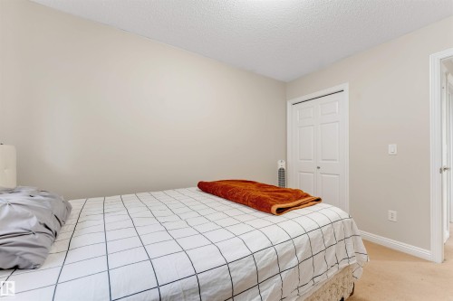 Room featuring neutral wall paint, white trim, and carpet flooring - 3012 25 Ave Avenue, Edmonton, AB 