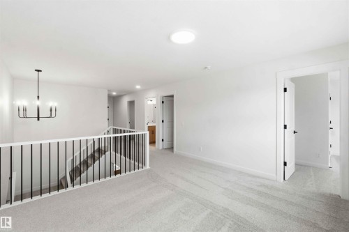 Upper level landing featuring light gray carpet flooring and white walls - 1085 Cristall Crescent, Edmonton, AB 