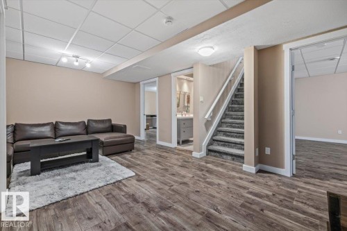 Spacious lower level featuring wood-finish flooring, recessed lighting, and a drop ceiling - 4708 47A Avenue, Onoway, AB 