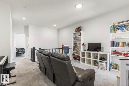 Carpeted upper-level bonus room featuring white walls and recessed lighting - 19703 29 Avenue, Edmonton, AB 