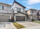 Contemporary two-story residence featuring a distinctive sloped roofline and contrasting exterior finishes - 19703 29 Avenue, Edmonton, AB 