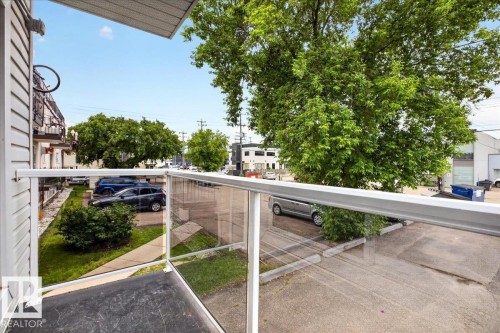 Balcony featuring aluminum and glass railing, providing an outdoor extension to the living space - Edmonton, AB 