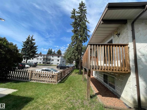 Upper-level wood deck with vertical balusters - 8930B 144 Avenue, Edmonton, AB 