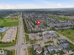 Aerial perspective showcasing an established residential neighborhood with detached homes - 