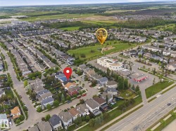 Aerial perspective highlighting a residential neighborhood with varied housing styles - 