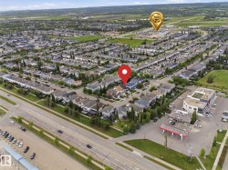 Aerial perspective showcasing a developed residential community with extensive green spaces and mature trees - 