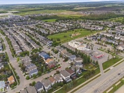 Expansive aerial perspective showcasing a residential development with diverse housing styles - 