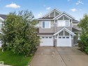 Modern multi-level exterior with gabled roof lines and contrasting siding - 2155 67 Street, Edmonton, AB 