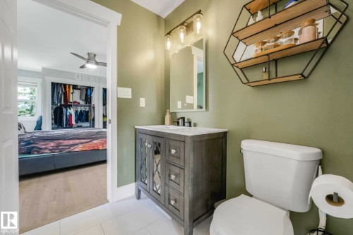 Modern bathroom vanity with a white countertop and rectangular sink - 553006 Range Road 153, Rural Two Hills County, AB - Indoor Photo Showing Bathroom