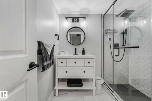 Bathroom featuring a glass-enclosed shower with subway tile in a herringbone pattern - 553006 Range Road 153, Rural Two Hills County, AB - Indoor Photo Showing Bathroom