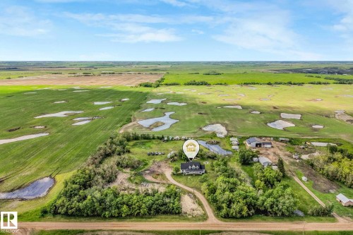 Rural property featuring a residence, outbuildings, and extensive surrounding land - 553006 Range Road 153, Rural Two Hills County, AB - Outdoor With View
