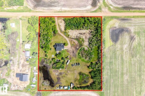 Expansive property featuring a central residence, surrounding wooded areas, open land, and a pond - 553006 Range Road 153, Rural Two Hills County, AB -  With View