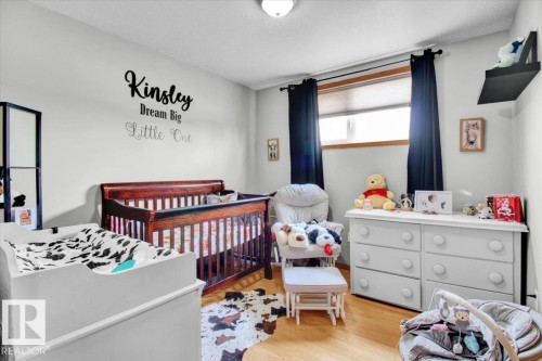Light-toned walls with wood-finish flooring - 5506 53St, Mundare, AB 