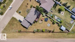 Aerial view highlighting the property's expansive lot with various outdoor features - 