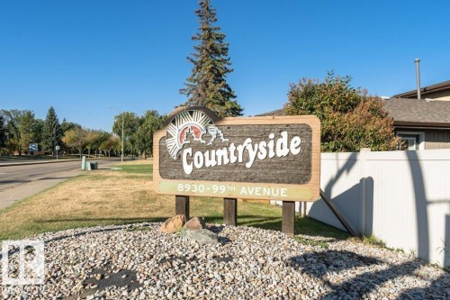 Countryside community signage with address markers, set on a gravel and grass base - 25 8930 99 Avenue, Fort Saskatchewan, AB 
