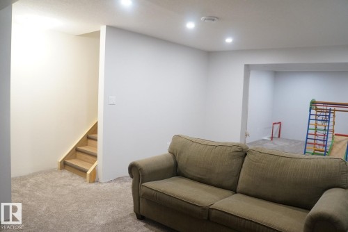 Finished room featuring recessed lighting, light gray walls, and carpet flooring - 25 8930 99 Avenue, Fort Saskatchewan, AB 