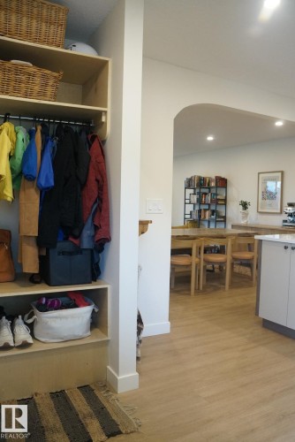 Built-in shelving unit with hanging rod and lower cubbies - 25 8930 99 Avenue, Fort Saskatchewan, AB 