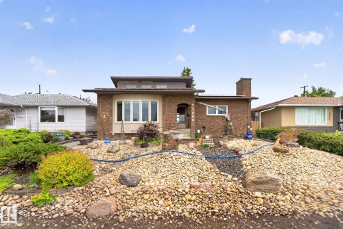 Brick exterior with a prominent bay window and an elevated front entrance - 5808 Austin O'Brien Road, Edmonton, AB 