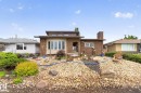 Brick exterior with a prominent bay window and an elevated front entrance - 5808 Austin O'Brien Road, Edmonton, AB 