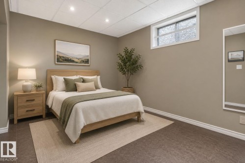 Bedroom featuring light tan walls, recessed lighting, and resilient flooring - 5808 Austin O'Brien Road, Edmonton, AB 