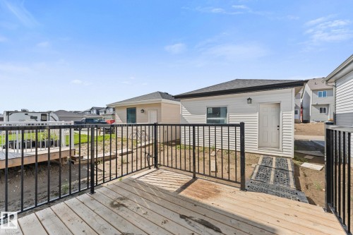 Spacious exterior deck with dark metal railings - 3606 42 Avenue, Beaumont, AB 