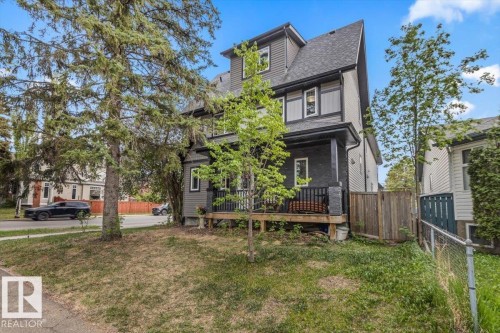 Contemporary multi-level residence featuring dark gray siding and white window trim - 3 7210 96 Street, Edmonton, AB - Outdoor