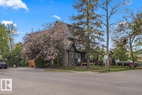 Two-story property with dark gray siding and white trim accents - 3 7210 96 Street, Edmonton, AB - Outdoor