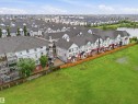 Contemporary townhome community featuring a private fenced yard and a waterside location - 64 655 Watt Boulevard, Edmonton, AB 