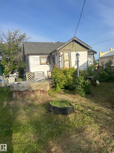 White-sided exterior with a dark shingle roof - 5023 50 Street, Vilna, AB - Outdoor